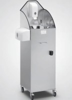 Komplettaufnahme des Handwaschbeckend auf grauem Hintergrund. Details wie die Kniebetätigung sind erkennbar. Ansicht von Komplettaufnahme des Handwaschbeckend auf grauem Hintergrund. Details wie die Kniebetätigung sind erkennbar. Ansicht von schräg vorne.